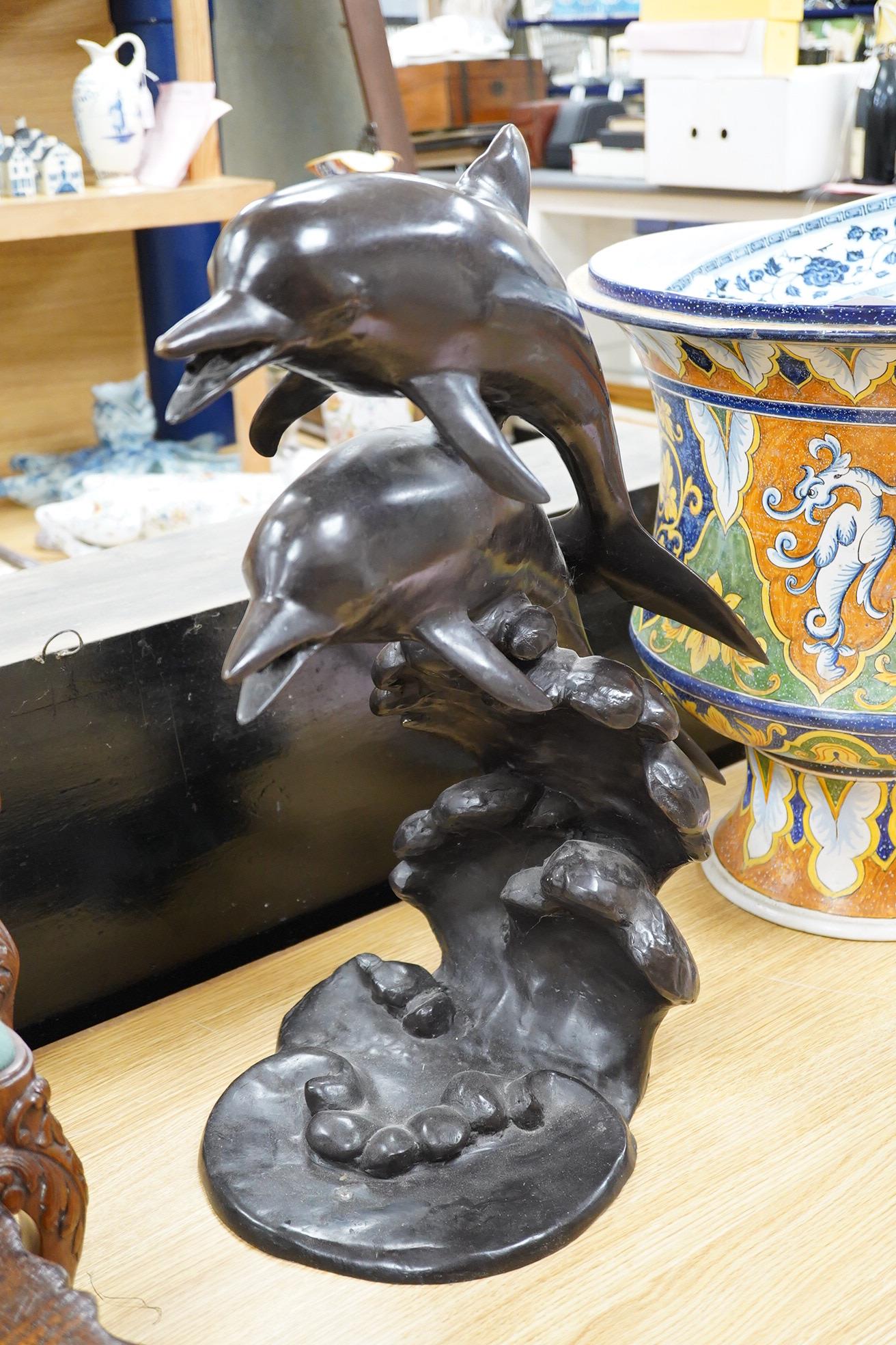 A large contemporary bronze dolphin fountain water feature, 61cm high